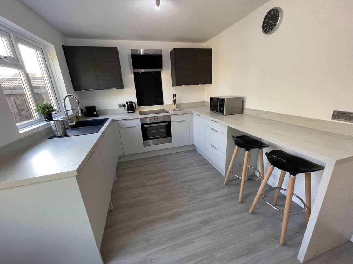 Kitchen with breakfast bar and stools